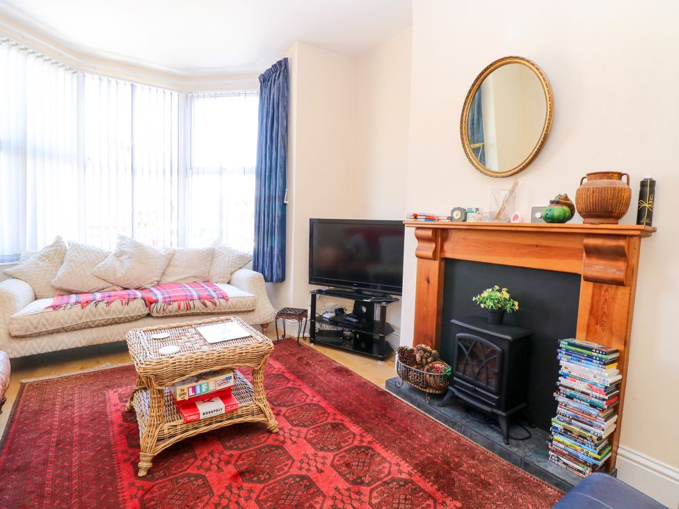 A living room with a television and a coffee table at 33 North Denes Great Yarmouth