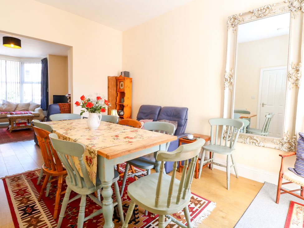 A dining room with a table and chairs at 33 North Denes in Great Yarmouth
