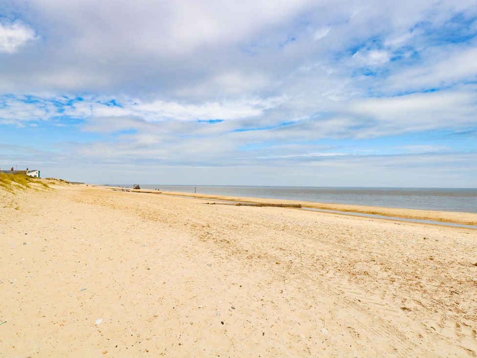 A beach with sand and water at 33 North Denes in Great Yarmouth
