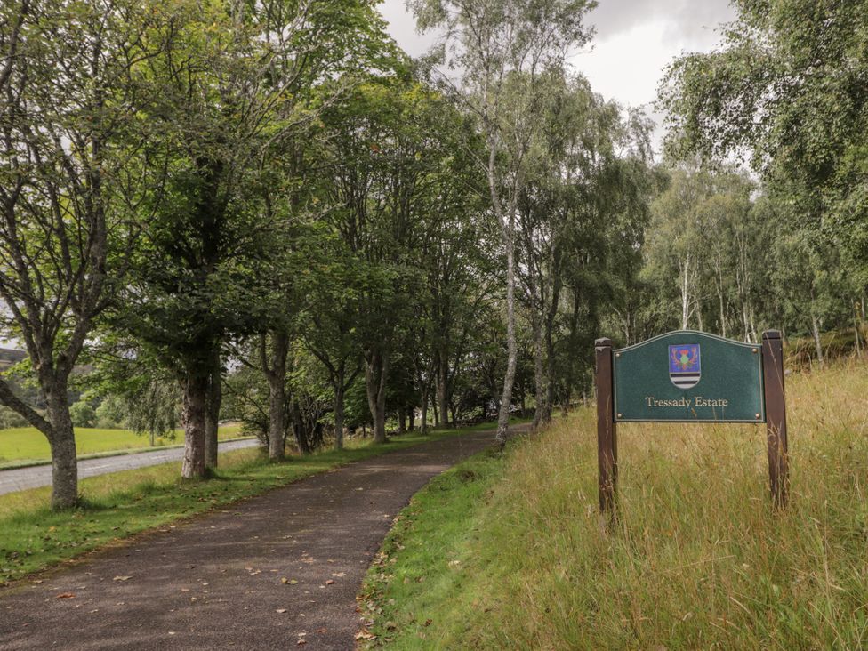 A pathway and sign indicating Tressady Estate in Rogart