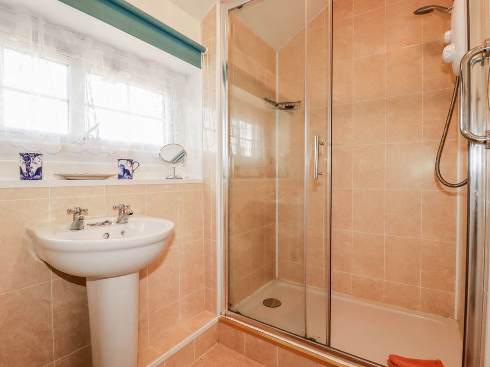 A bathroom featuring a shower and a sink at The Granary in 