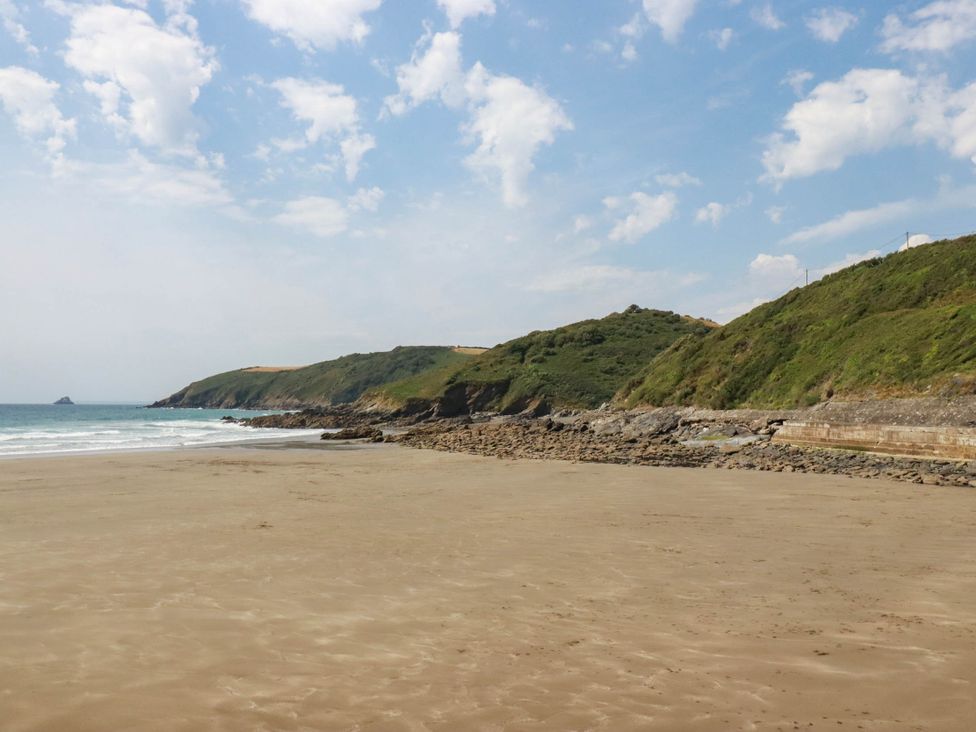 A beach with cliffs and ocean at The Granary in 