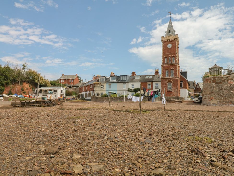 A view of buildings and a clock tower at Tower View Cottage in Lympstone