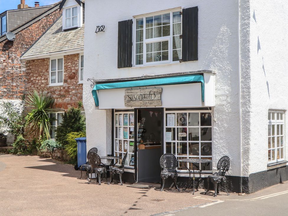 A tea room with outdoor seating at Tower View Cottage in Lympstone