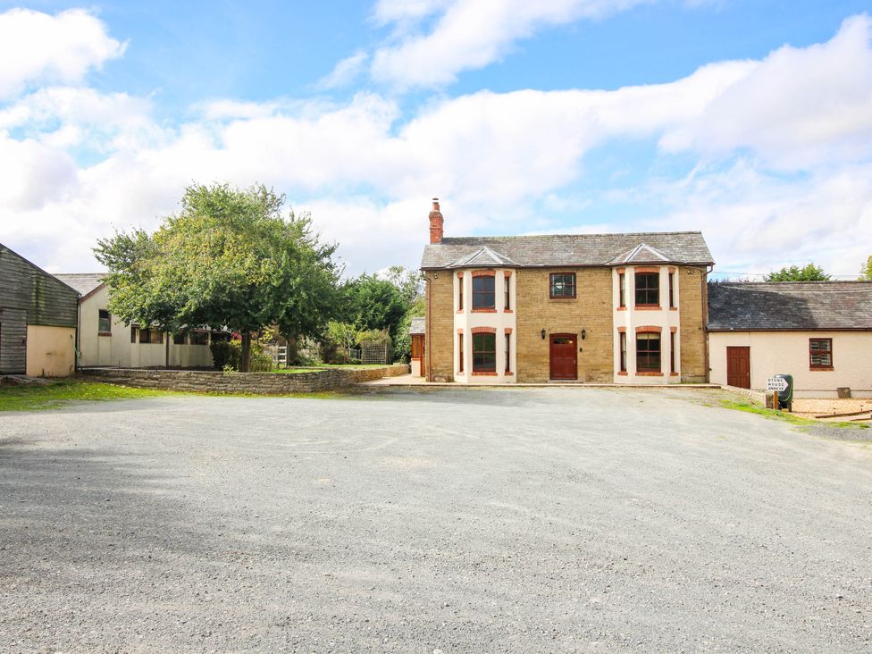 A house with trees and parking area at Stone House Farm in Cobnash near Leominster