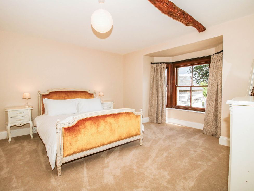 A bedroom with a bed and nightstands at Stone House Farm in Cobnash near Leominster