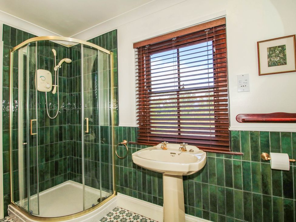 A bathroom with a shower and sink at Stone House Farm in Cobnash near Leominster