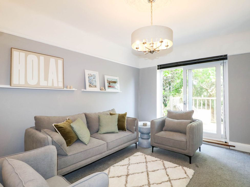 A living room with sofa and armchairs at 41 Terminus Avenue Bexhill-On-Sea