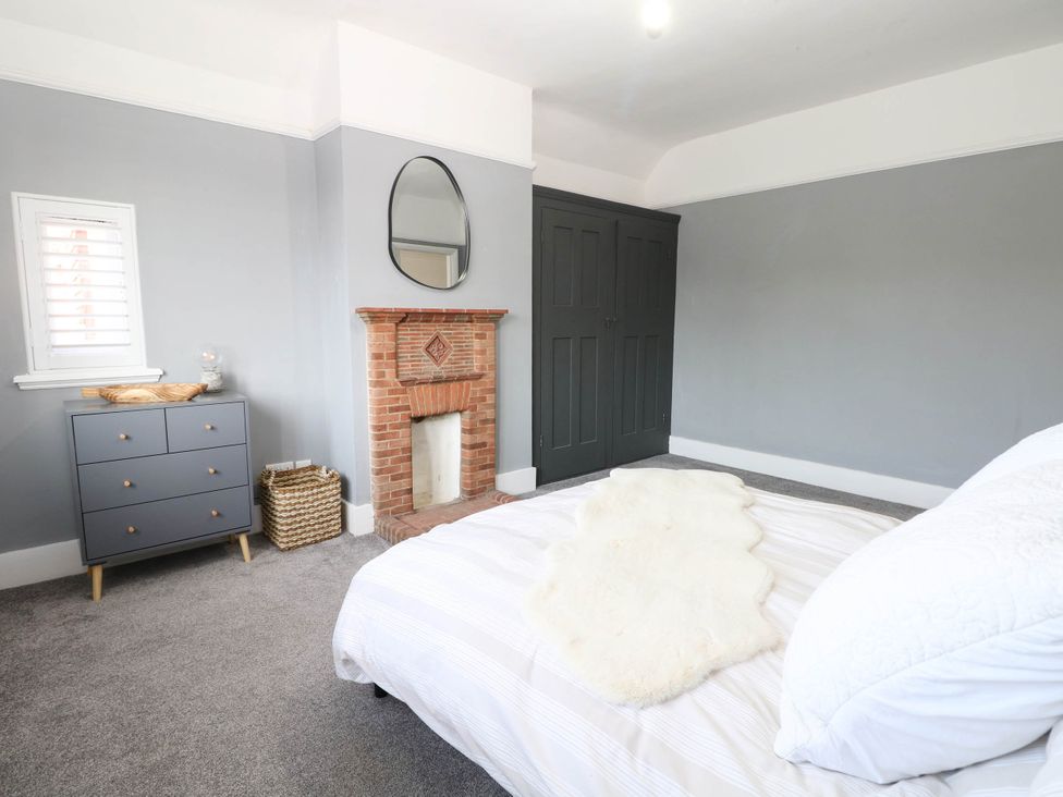 A bedroom with a bed and a chest of drawers at 41 Terminus Avenue Bexhill-On-Sea
