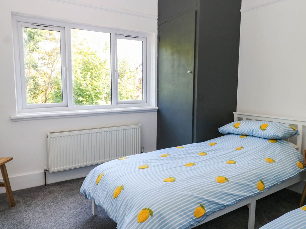 A bedroom with two single beds and a window at 41 Terminus Avenue Bexhill-On-Sea