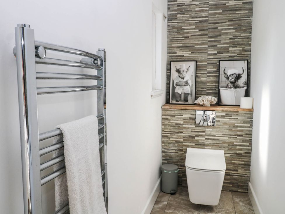 A bathroom with towel rail and toilet at 41 Terminus Avenue Bexhill-On-Sea