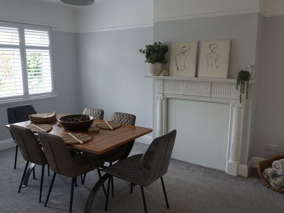 A dining room with a table and chairs at 41 Terminus Avenue in Bexhill-On-Sea