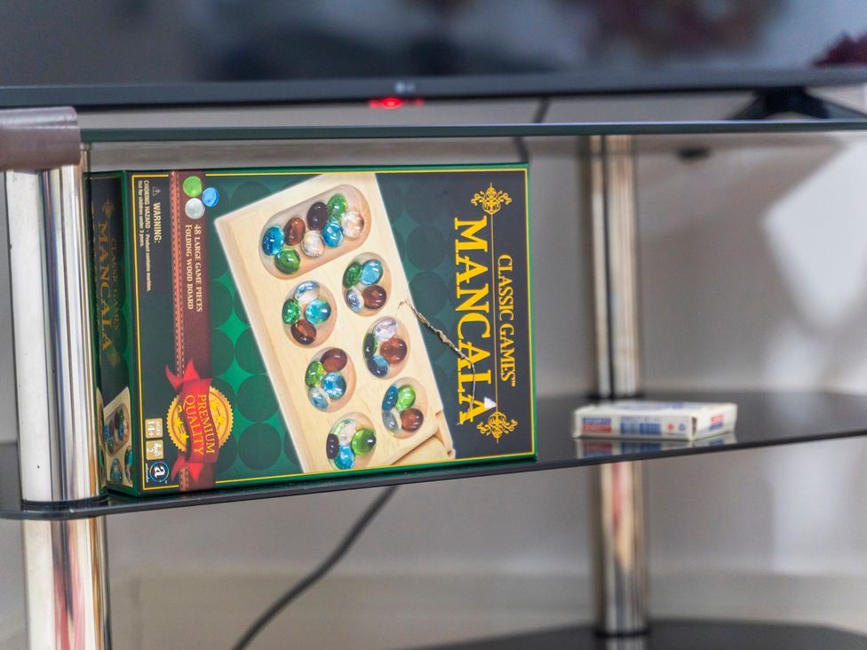 A Mancala game box and playing cards on a table at 2 Pump House in Birmingham