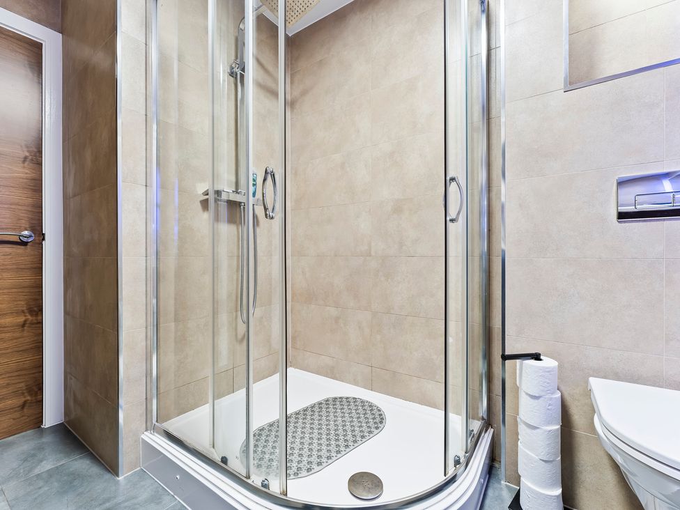 A bathroom with a shower and toilet at 2 Pump House in Birmingham