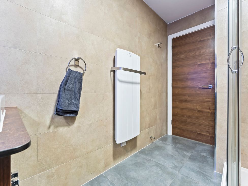 A bathroom with a towel rack and radiator at 2 Pump House in Birmingham