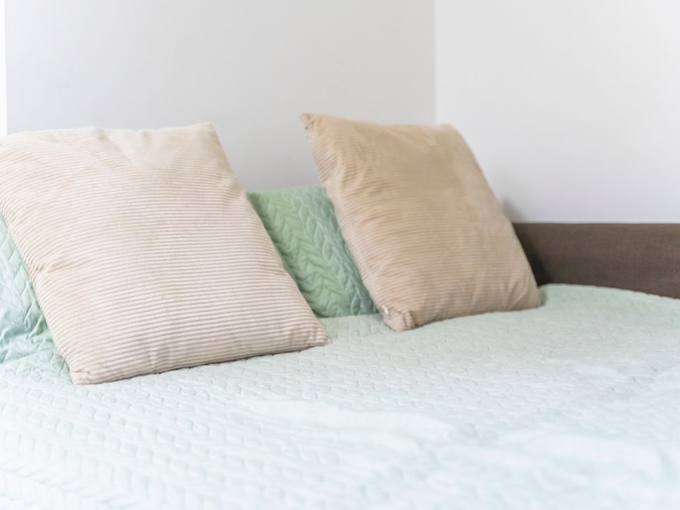 A bed with two pillows at 2 Pump House in Birmingham