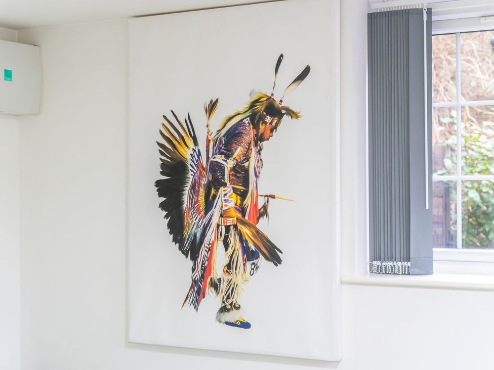 A picture of a person in traditional attire on the wall at 2 Pump House Birmingham