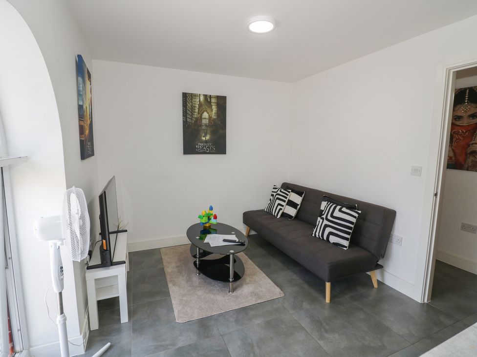 A living room with a sofa and coffee table at 3 Pump House in Birmingham