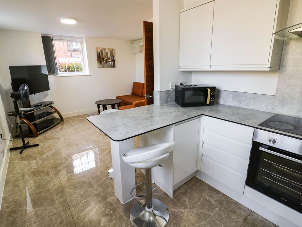 A kitchen with a microwave and stove at 4 Pump House in Birmingham