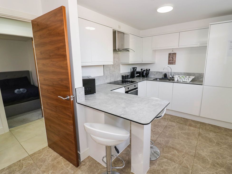 A kitchen with a counter and appliances at 4 Pump House Birmingham