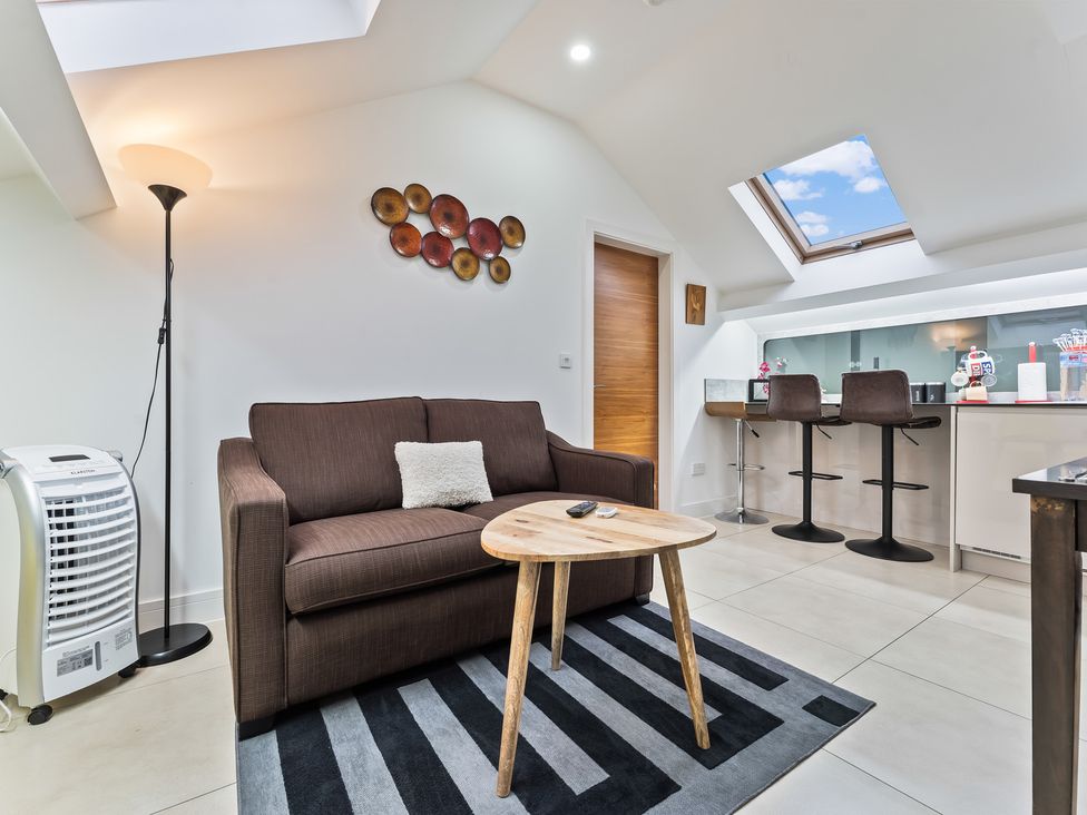 A living room with a sofa and coffee table at 5 Pump House in Birmingham