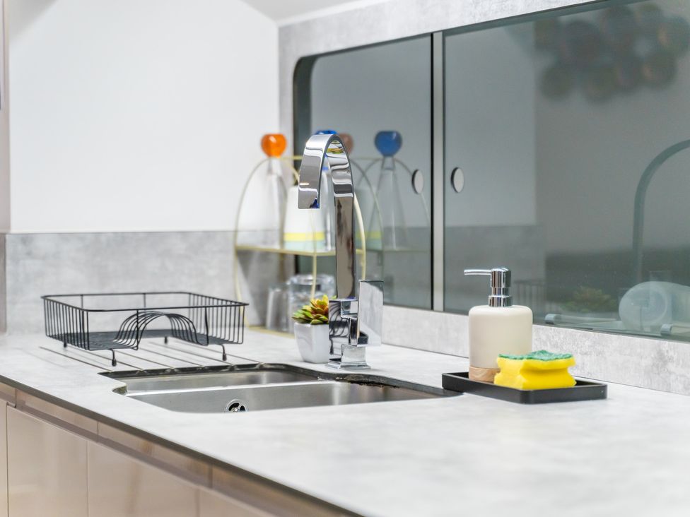 A kitchen with a sink and faucet at 5 Pump House Birmingham