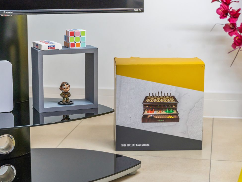 A storage unit with a figurine and games at 5 Pump House Birmingham