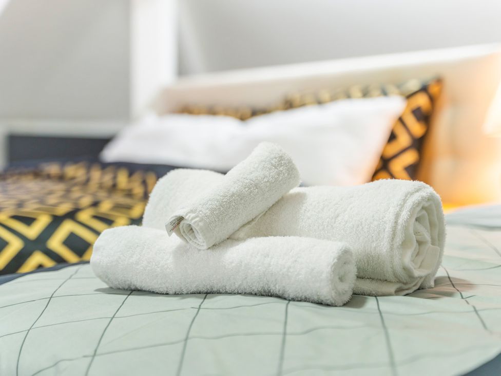 Towels on a bed at 5 Pump House in Birmingham