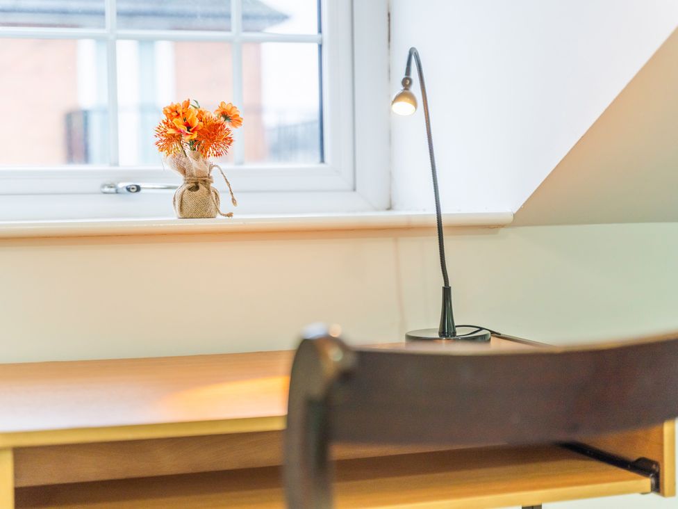 An office with a desk and a lamp at 5 Pump House in Birmingham