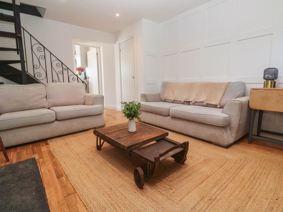 A living room with sofas and a coffee table at The Lookout in Redruth
