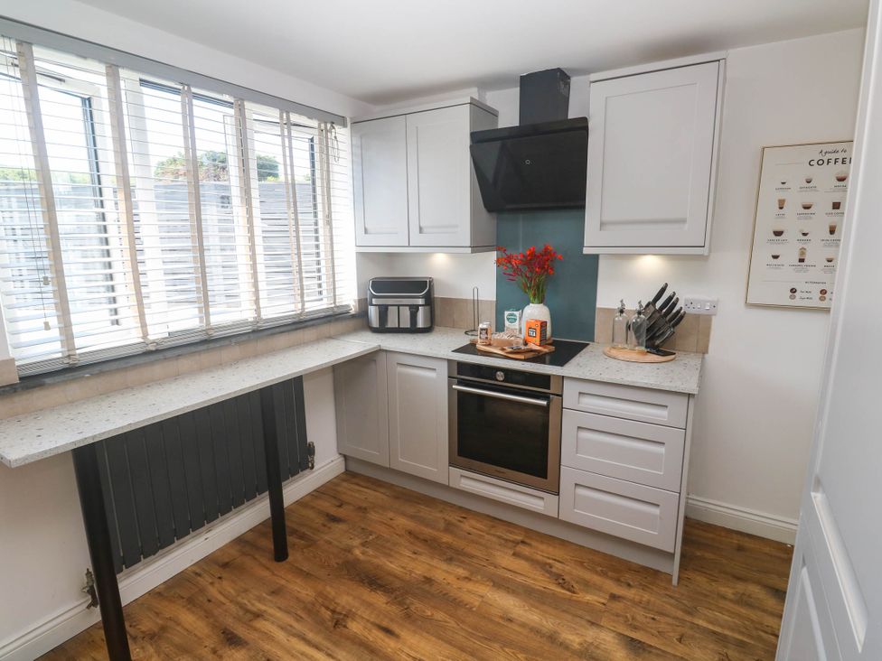A kitchen with cabinets and countertop at The Lookout in Redruth