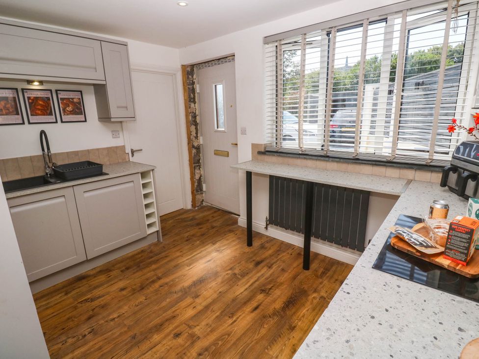 A kitchen with a sink and cabinets at The Lookout in Redruth