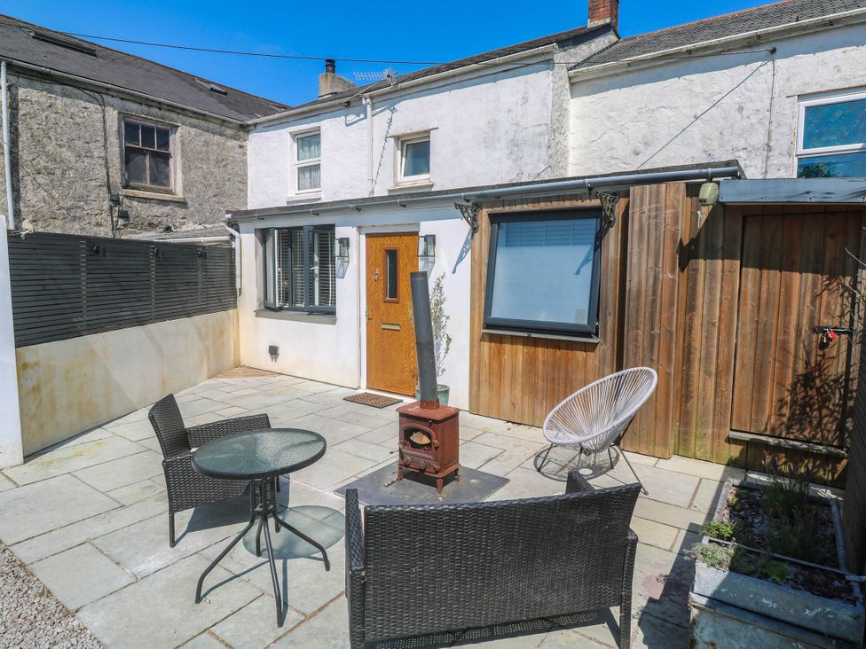 A garden area with seating and a heater at The Lookout in Redruth