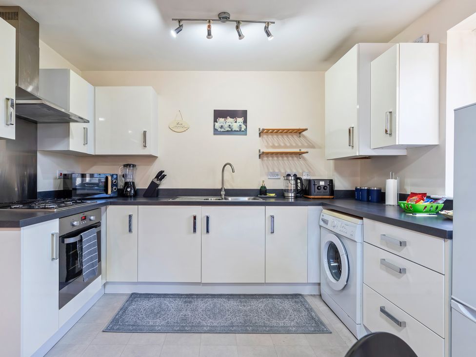 A kitchen with appliances and a sink at Flat 34 Herbert James Close Birmingham