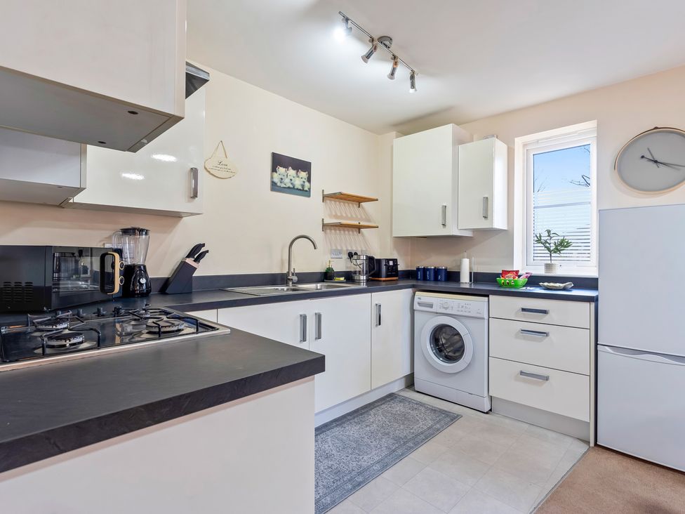 A kitchen with cabinets and appliances at Flat 34 Herbert James Close in Birmingham