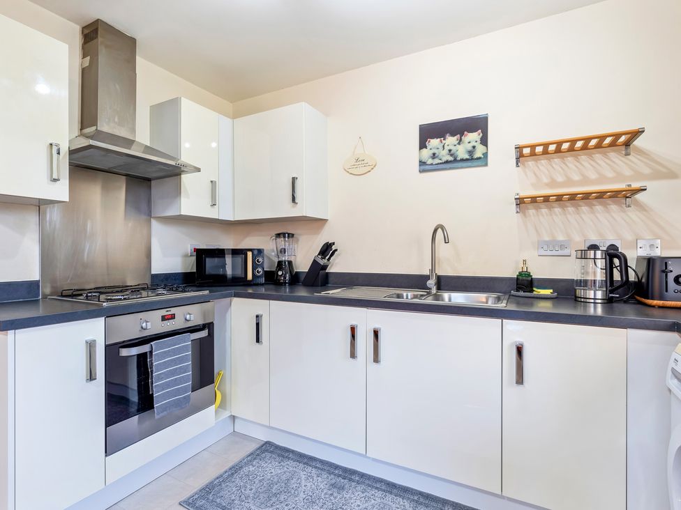 A kitchen with appliances and utensils at Flat 34 Herbert James Close Birmingham