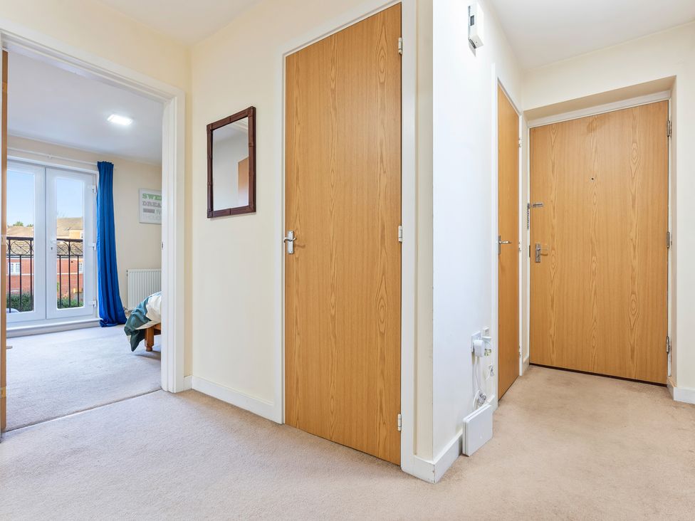 A hallway with doors and a window at Flat 34 Herbert James Close Birmingham