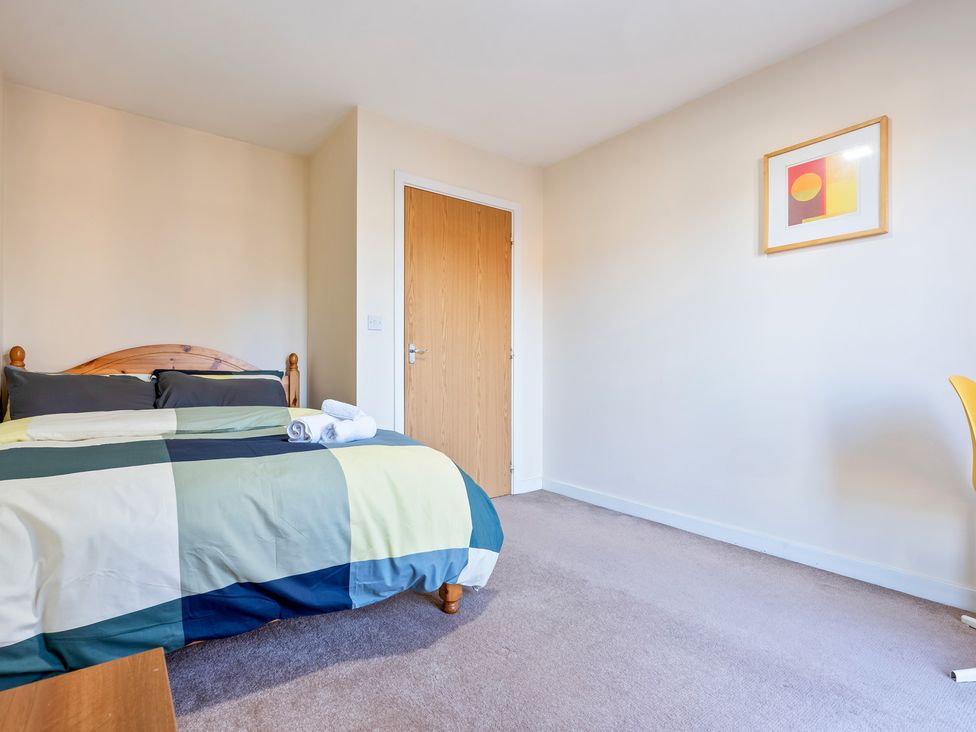 A bedroom with a bed and a door at Flat 34 Herbert James Close Birmingham