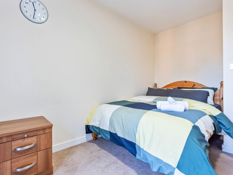 A bedroom with a bed and nightstand at Flat 34 Herbert James Close in Birmingham