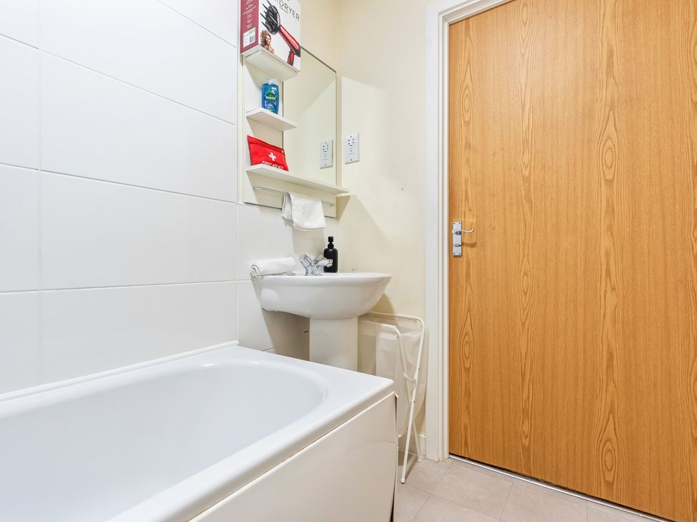 A bathroom with a sink and bathtub at Flat 34 Herbert James Close in Birmingham