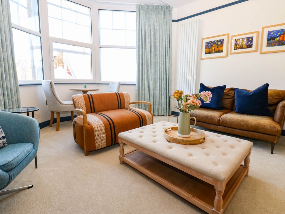 A living room with a sofa and armchair at Bishops Quarter - Barrington in Bishop Auckland