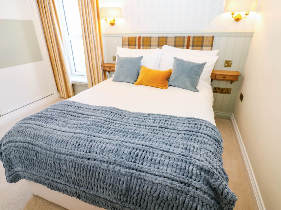 A bedroom with a bed and pillows at Bishops Quarter - Barrington in Bishop Auckland