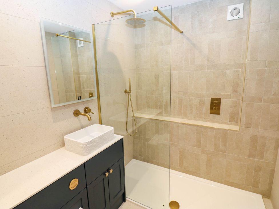 A bathroom with a shower and sink at Bishops Quarter - Barrington in Bishop Auckland
