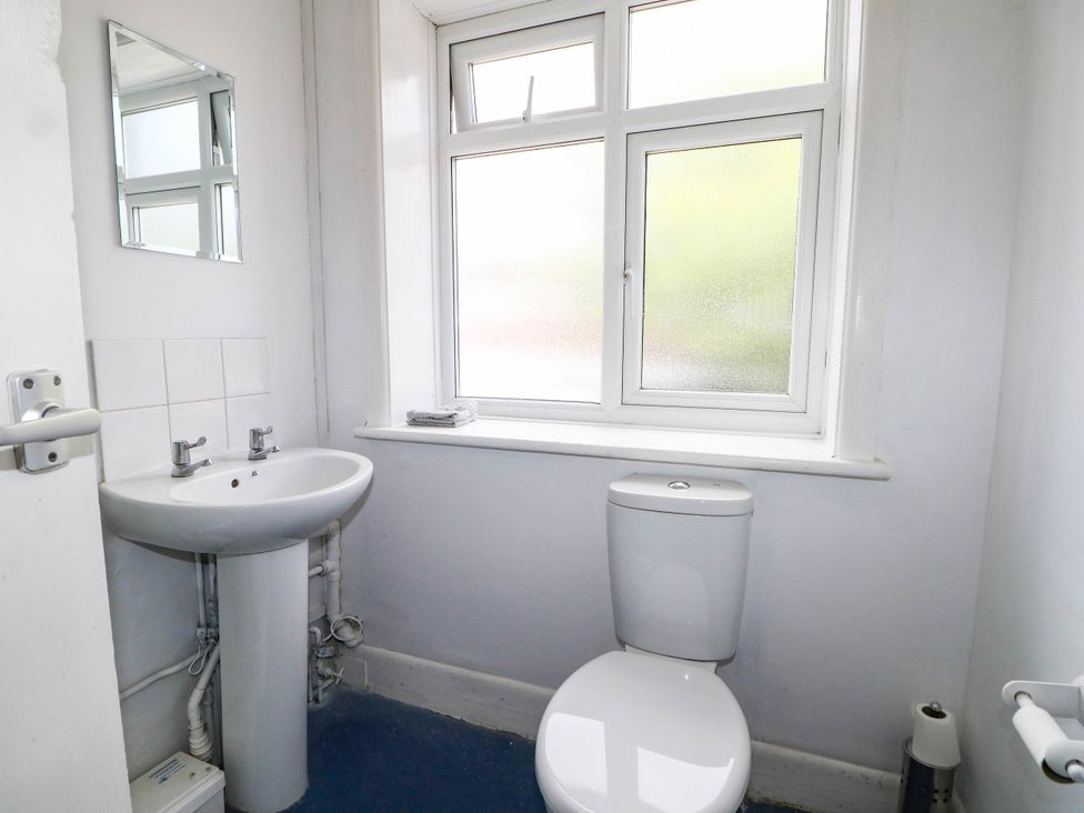 A bathroom with a sink and toilet at 90 A Station Road in New Milton
