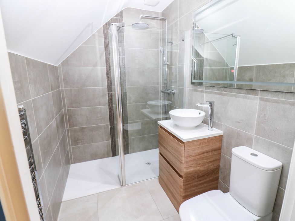 A bathroom with shower, sink and toilet at Bishops Quarter - Flambard in Bishop Auckland
