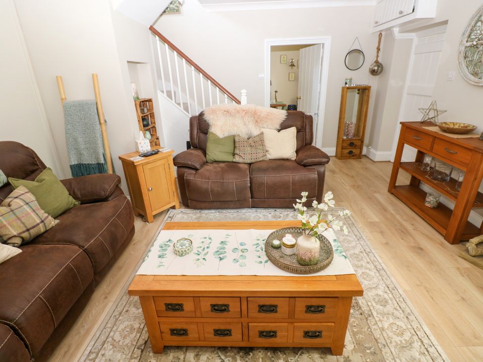 A living room with a coffee table and sofa at St.Twynells Farm Pembroke
