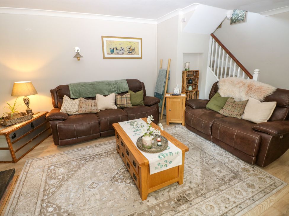 A living room with sofas and a coffee table at St.Twynells Farm in Pembroke