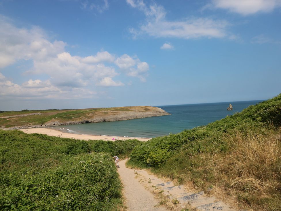 A beach view with hills and path at St.Twynells Farm in Pembroke