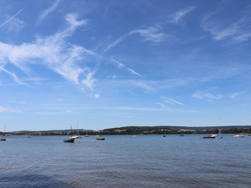 A view of water with boats and hills at Beech Walk 3 Sandy Bay, Exmouth