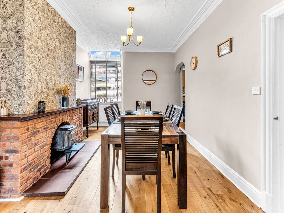 A dining room with a table and chairs at Stoke Townhouse in Stoke-on-Trent